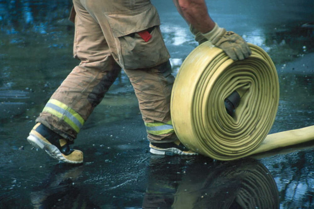Rolling hose on wet pavement