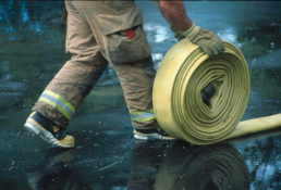 Rolling hose on wet pavement