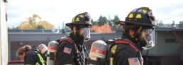 Northshore Firefighters wearing oxygen tanks