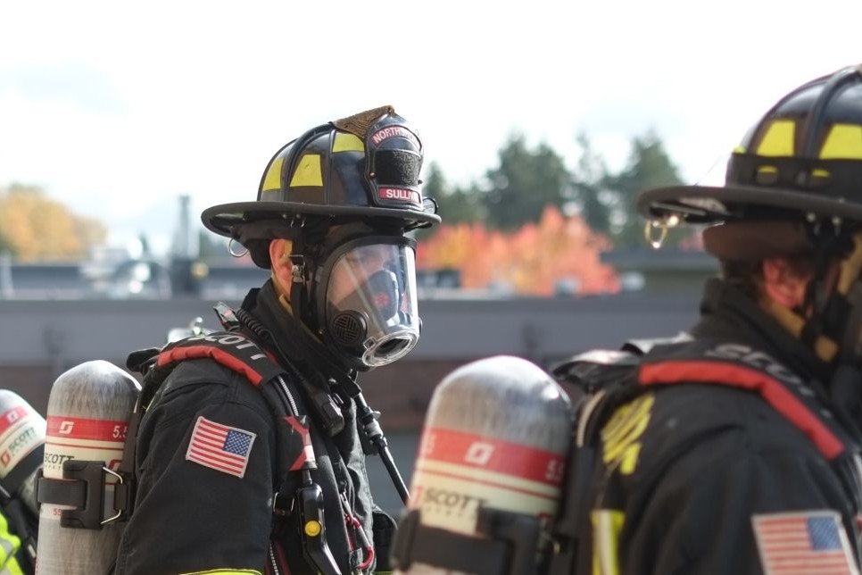 Northshore Firefighters wearing oxygen tanks