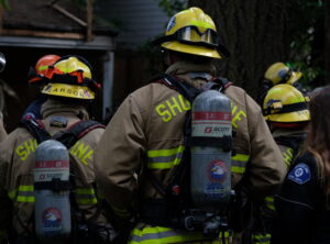 Firefighters wearing air tanks