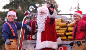 Santa on back of fire engine