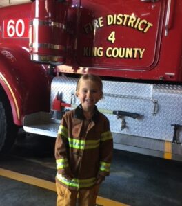 Small child in firefighter uniform