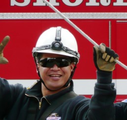 Fire fighter pointing at camera